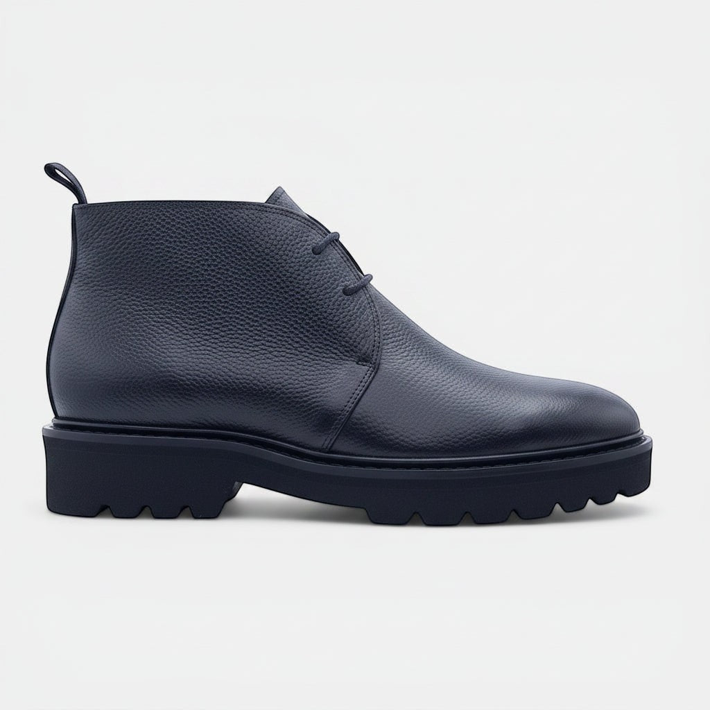 Barcon Getta Inc black textured leather chukka boots with lug sole and lace-up closure.