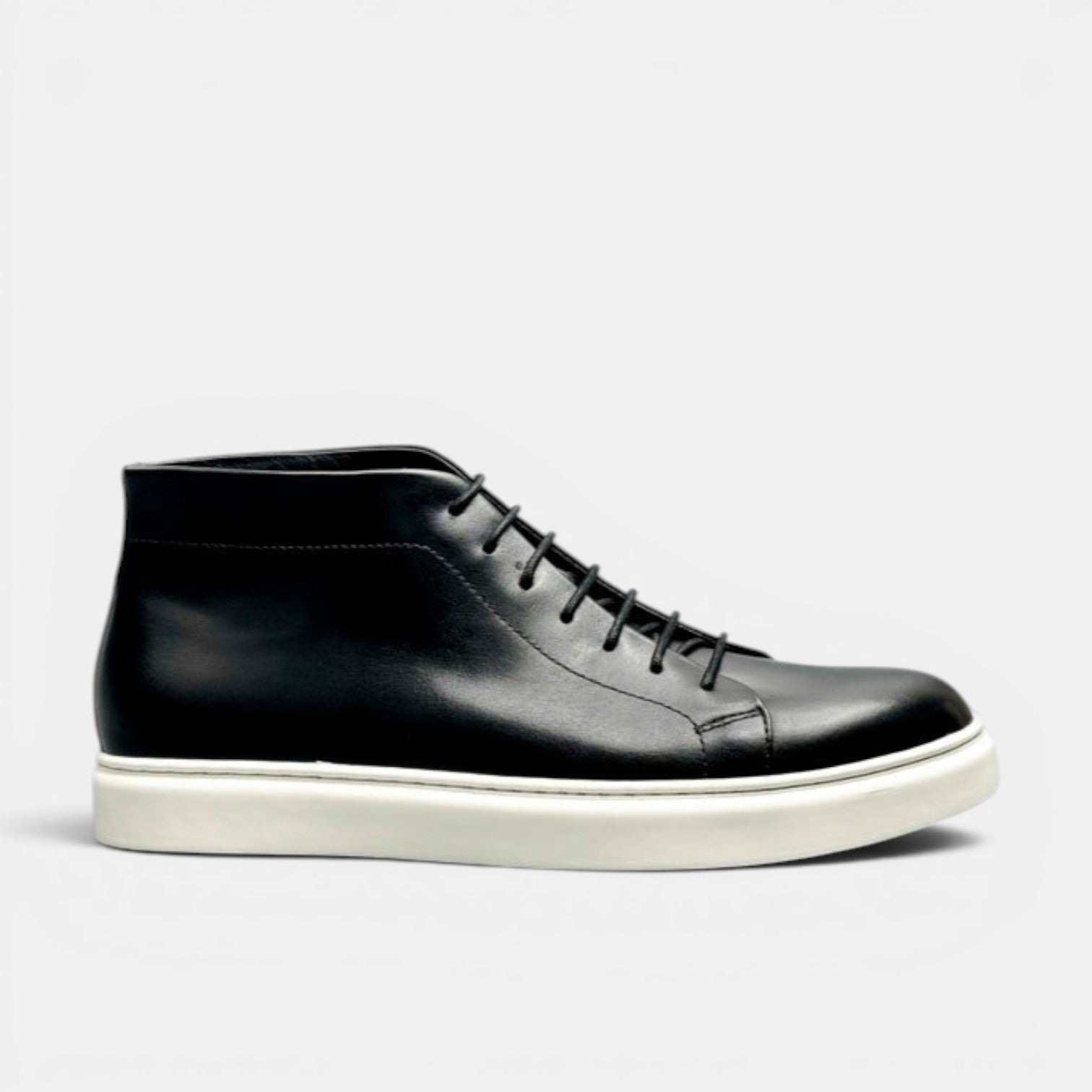 Barcon Getta Inc MEDA black leather high top sneakers with white rubber sole and lace-up closure.