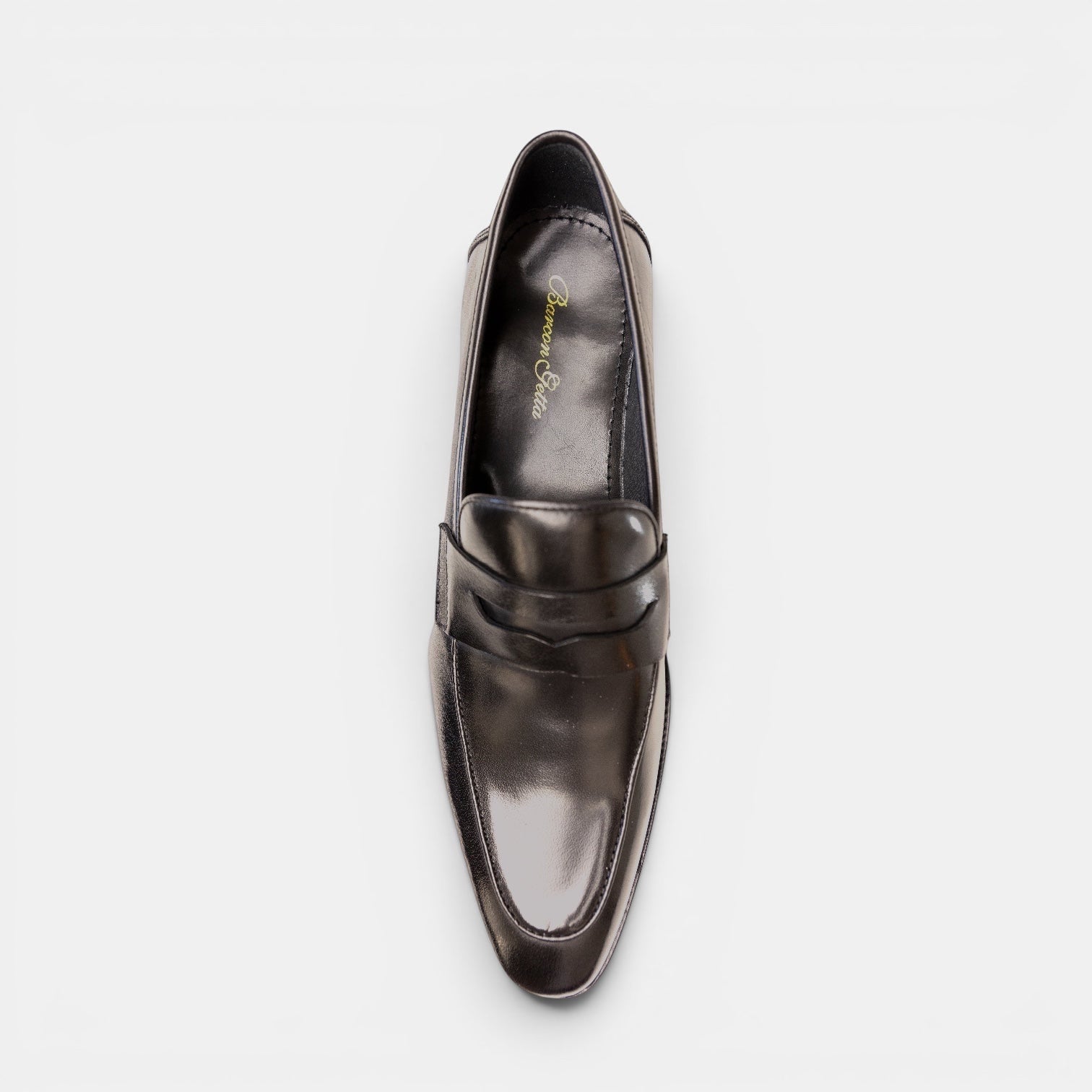 Barcon Getta Inc MONROVIA black polished leather penny loafers with a sleek silhouette and traditional strap.