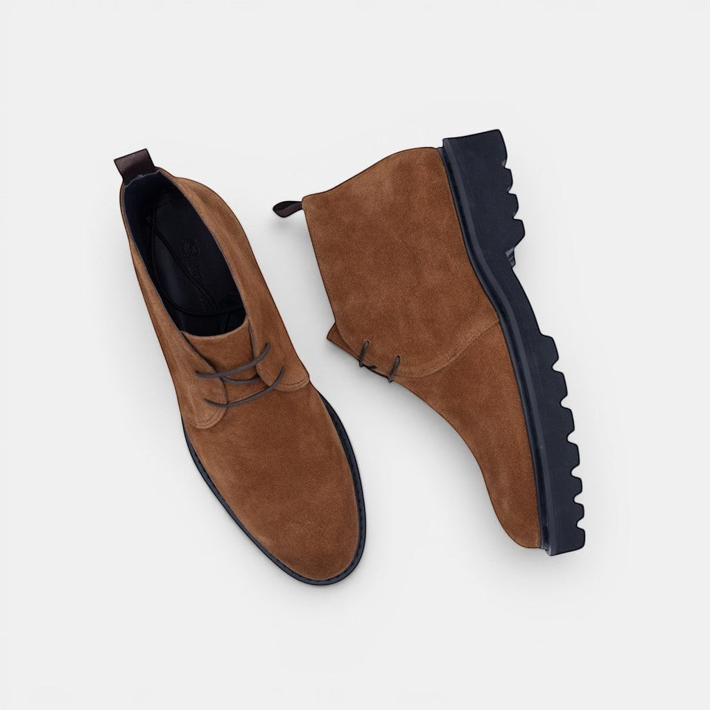 Barcon Getta Inc brown suede chukka boots with dark lug sole and lace-up closure.