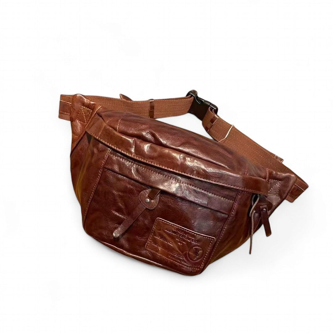 Barcon Getta Inc AXUMAWIT fanny bag in rich brown full grain Ethiopian leather with multiple zipper pockets and adjustable strap.