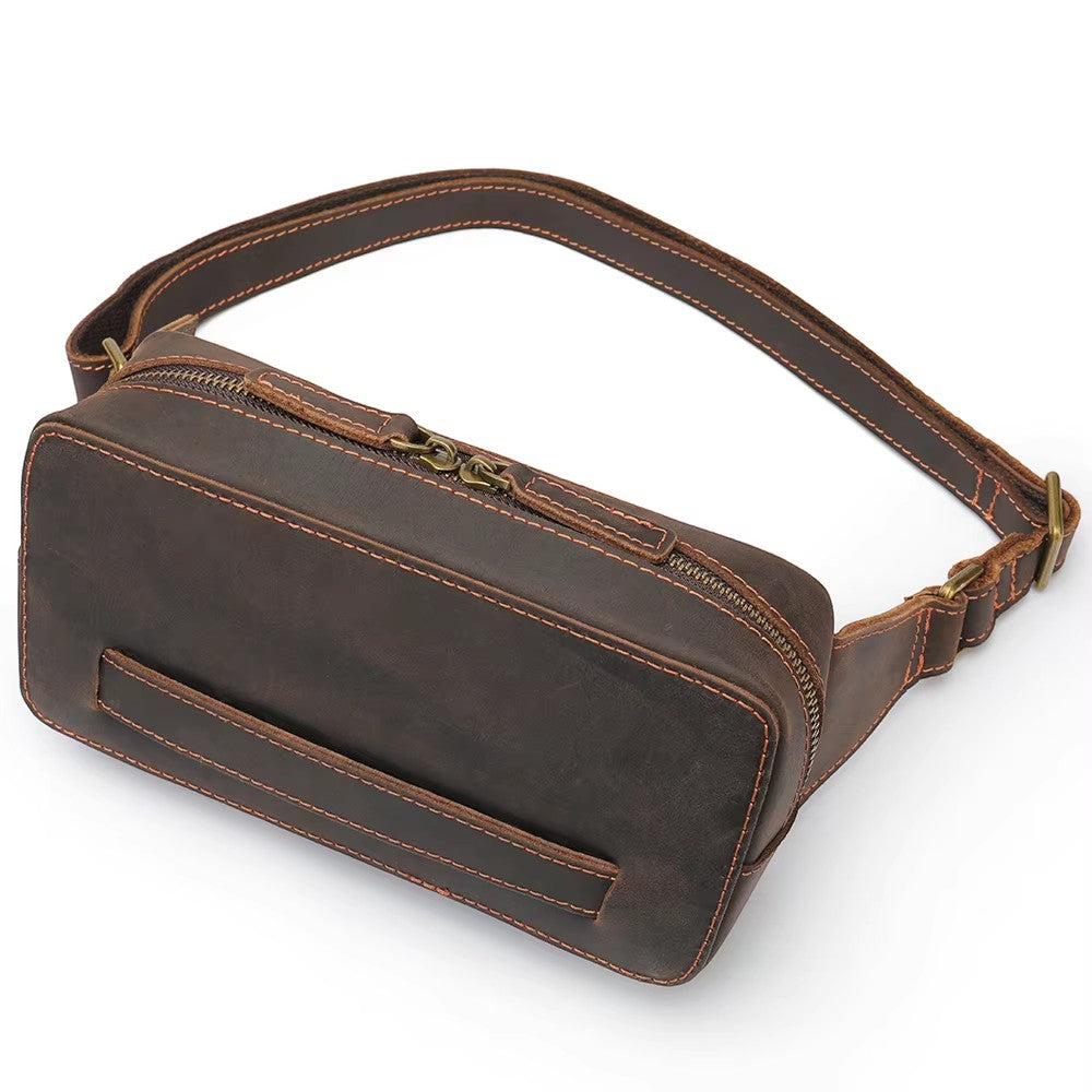 Barcon Getta Inc KANO fanny bag in dark brown full grain leather with multiple carrying styles and a zippered main pocket.