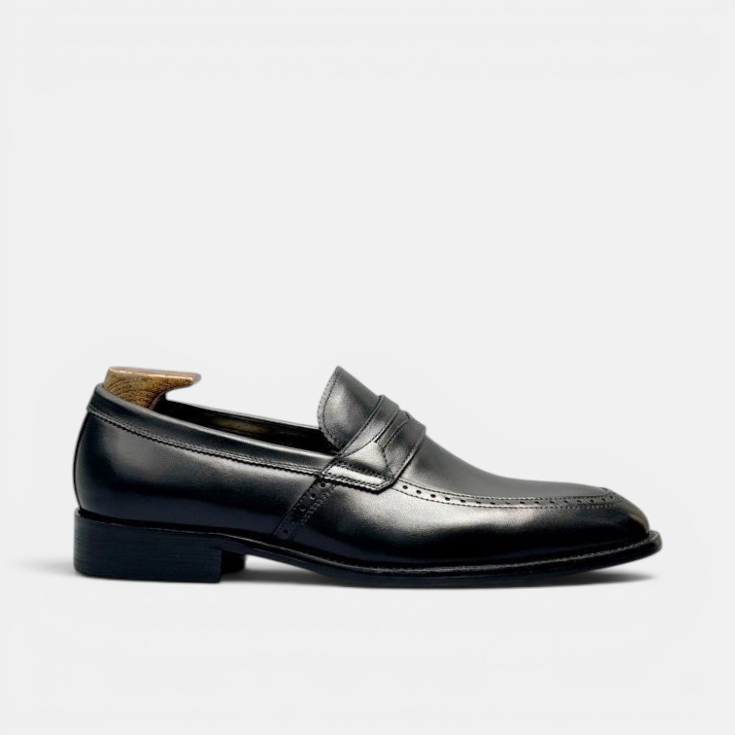 Barcon Getta Inc KINSHASA black leather penny loafers with subtle stitching and refined silhouette.