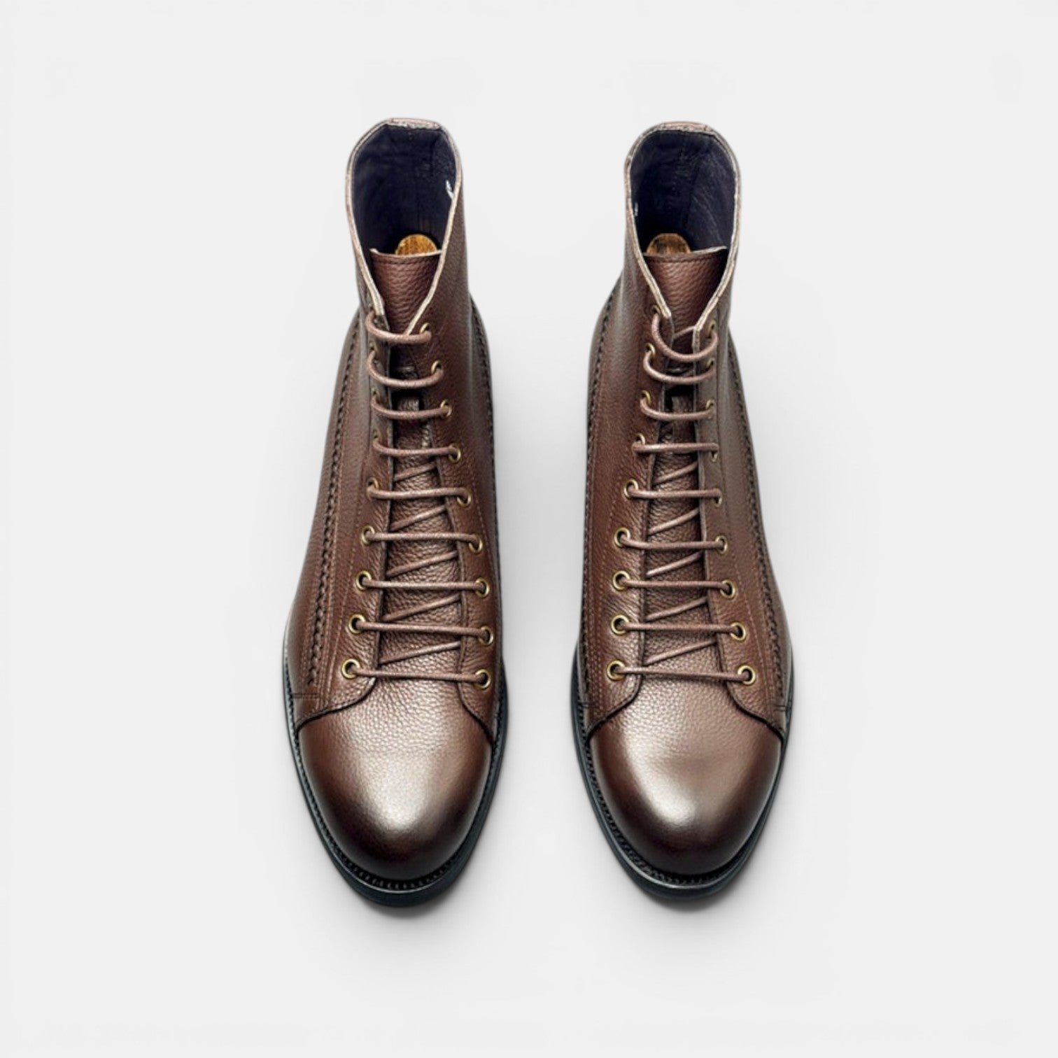 Barcon Getta Inc RABAT brown leather lace-up ankle boots with textured finish and metal eyelets.