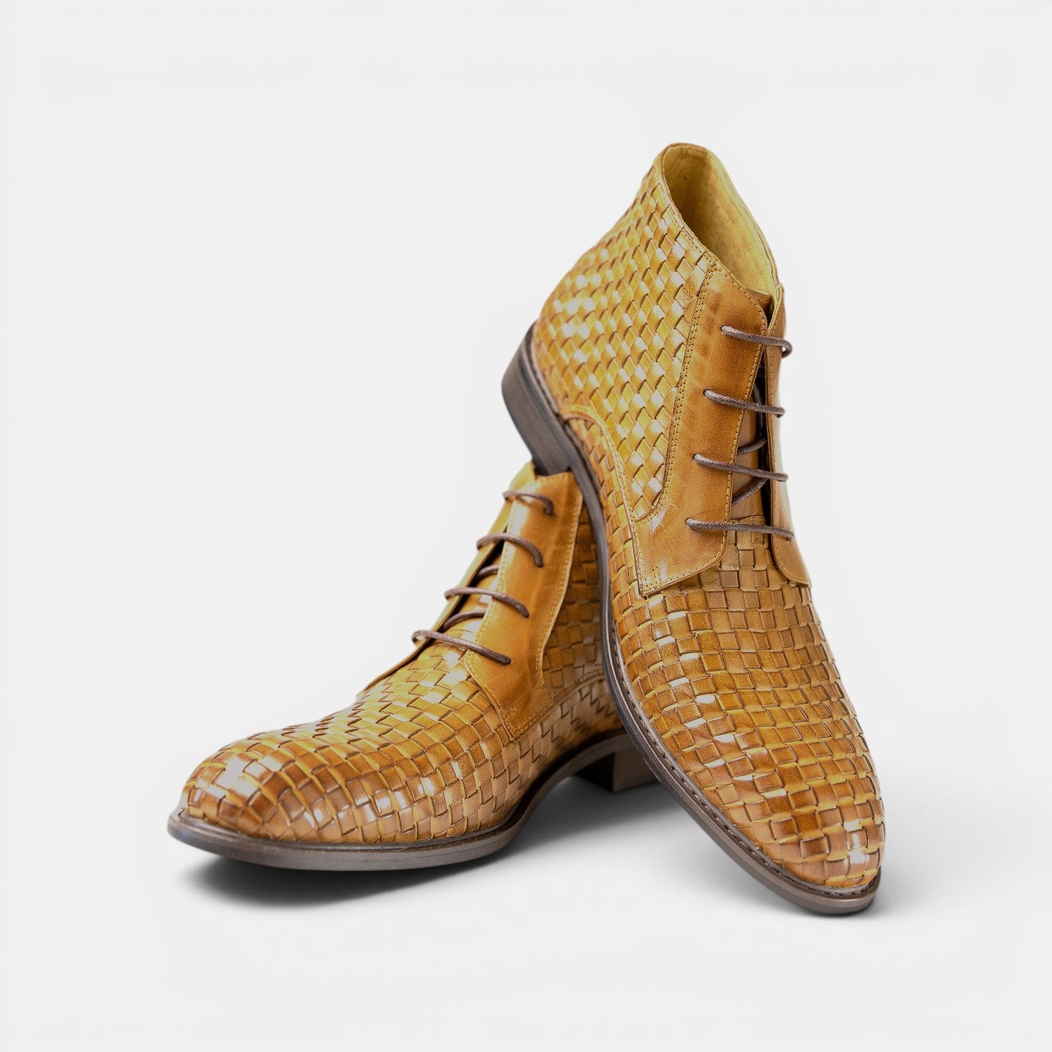 Barcon Getta Inc DAR ES SALAAM tan woven leather lace-up ankle boots with intricate texture.