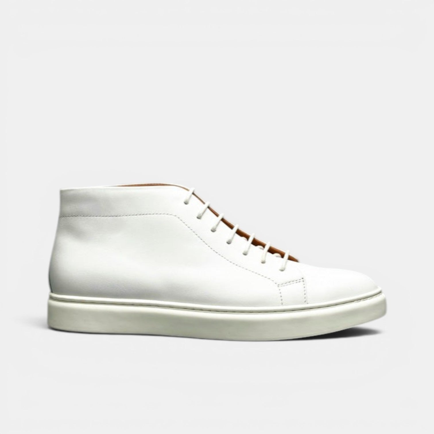 Barcon Getta Inc MEDA white leather high top sneakers with lace-up closure and rubber sole.