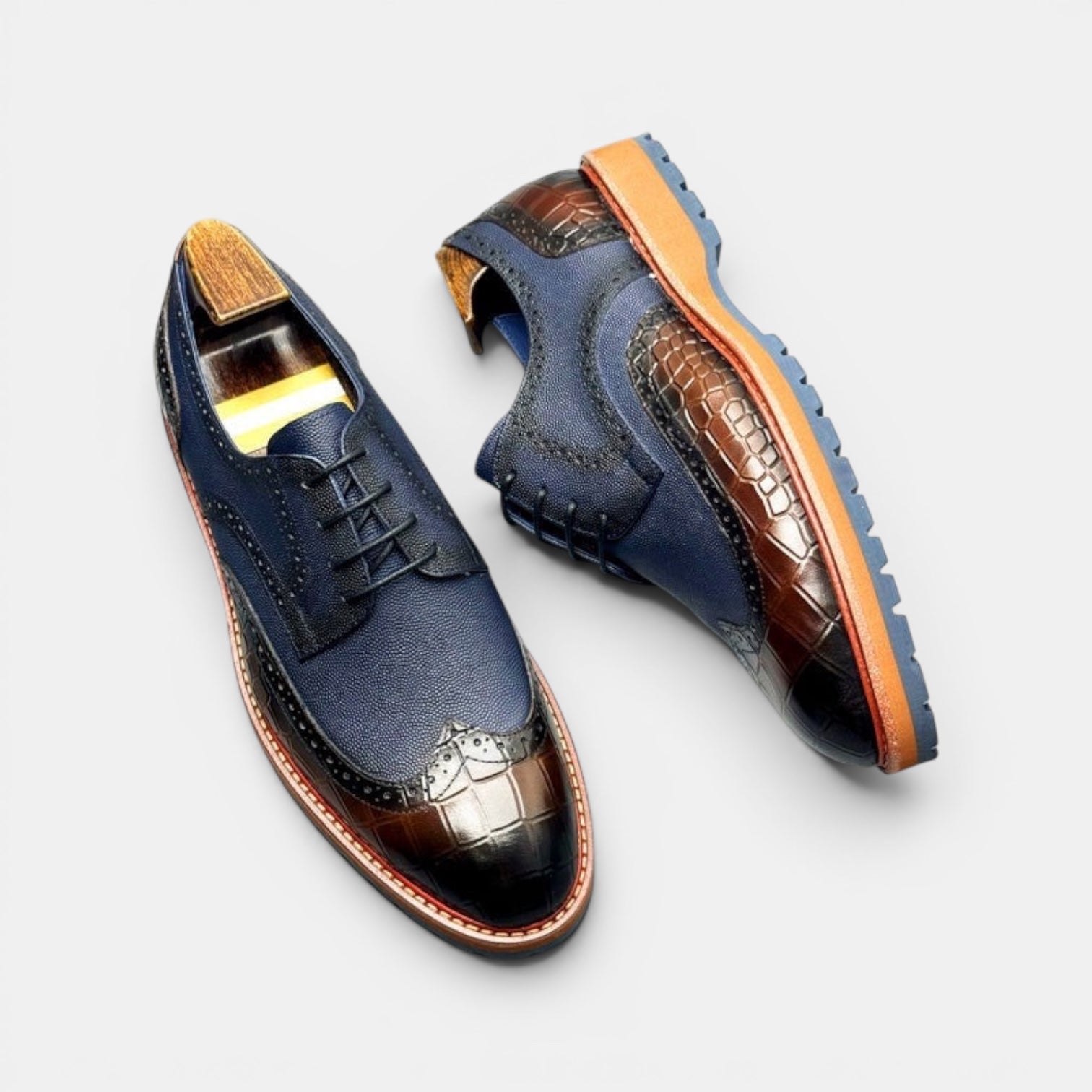 Barcon Getta Inc PORT-LOUIS navy leather wingtip brogues with brown croc-embossed toe and heel.