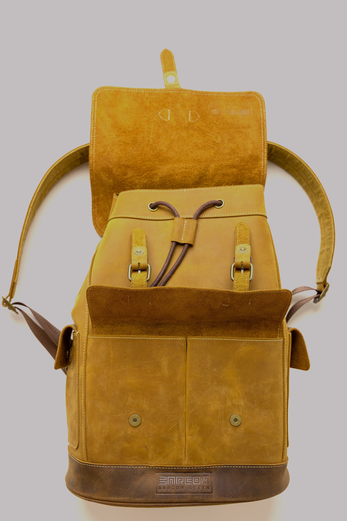 Ankelba Leather Backpack - A fashionable and functional backpack created in Ottawa, Canada, using top-notch leather. This backpack is the ideal fusion of fashion and utility for the contemporary traveler, with a roomy main area and numerous pockets.